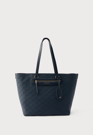 Borsa shopper Michael Kors blu navy con motivo logo in rilievo, tasca frontale con zip, manici lunghi e targhetta in pelle attaccata.