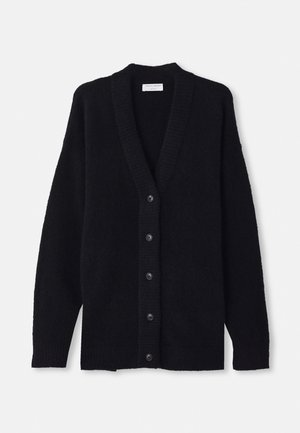 Black cardigan made of soft, fuzzy material, featuring a deep V-neck, ribbed cuffs, and six front buttons. Casual, oversized design.