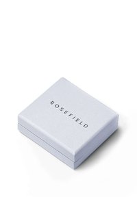 Svijetlosivi okvir s glatkom mat površinom, na kojem se na gornjoj strani nalazi ime branda "ROSEFIELD" u crnom tekstu. Kvadratnog je oblika.