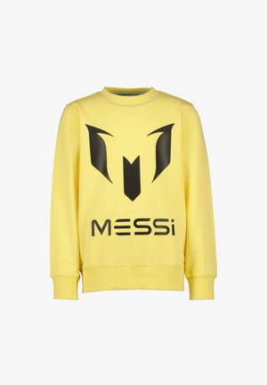 Żółta bluza z czarnym logo z stylizowaną literą „M” i napisem „MESSI”. Wykonana z miękkiego, teksturowanego materiału z ściągaczami.