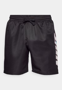 Sorte idrettsshorts med elastisk liv og justerbar snor. Har en fargerik "NIKE"-logo i vertikal design på den ene siden.