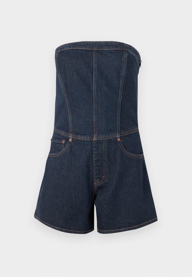 Denim strapless jumpsuit with a fitted bodice, shorts cut, contrast stitching, and two front pockets. Dark blue color and smooth texture.