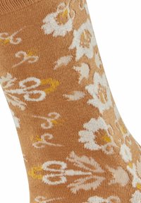 Beżowe skarpetki z kwiatowym wzorem w bieli i żółci, z misternymi detalami i miękkim, teksturowanym materiałem.