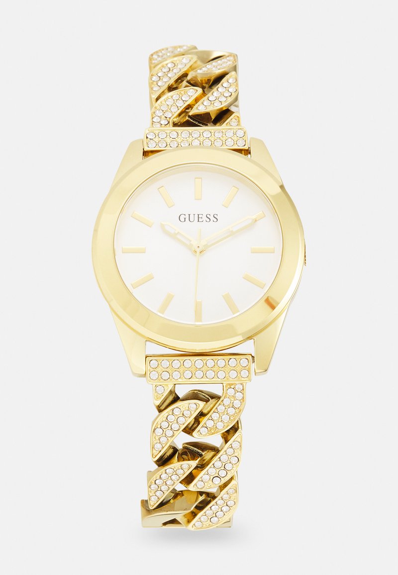 Relógio dourado com mostrador redondo, fundo branco, marcadores de horas dourados e bracelete de corrente adornado com strass claros.