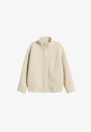 Veste en polaire de couleur crème avec un col montant, coupe décontractée et coutures visibles. Surface douce et texturée sans caractéristiques ou quincaillerie supplémentaires.