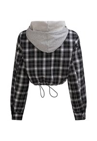 Skrócony flanelowy płaszcz w czarno-białą kratę, z szarym kapturem, ściągaczem w talii oraz długimi rękawami z guzikowymi mankietami.