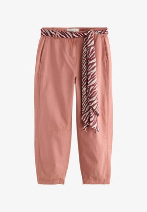 Dusty pink casual pants with side pockets and a red and white striped tied fabric belt hanging at the front.