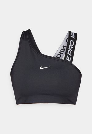 Sort sportsbh med én skulderrem og et bredt elastisk bånd med mærke. Glat, strækbart materiale med et lille hvidt Nike-logo på brystet.
