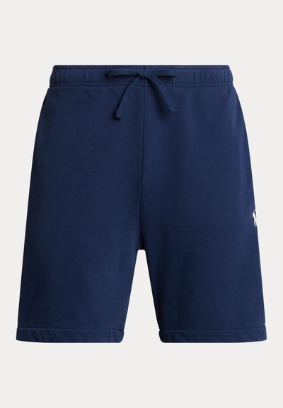 Tamsiai mėlyni sportiniai šortai iš minkštos medžiagos, su elastine juosmens juosta su raišteliu ir suapvalinta apačia. Šone mažas logotipo detalė.