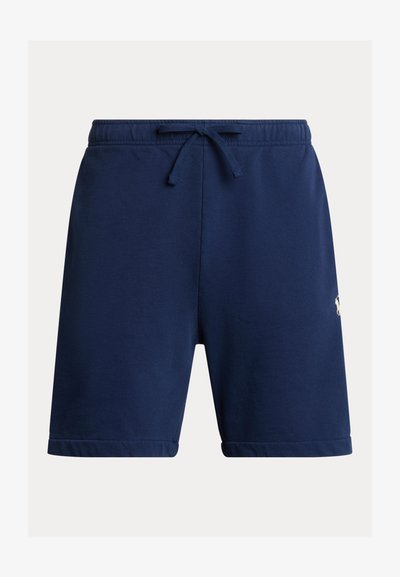 Tamsiai mėlyni sportiniai šortai iš minkštos medžiagos, su elastine juosmens juosta su raišteliu ir suapvalinta apačia. Šone mažas logotipo detalė.