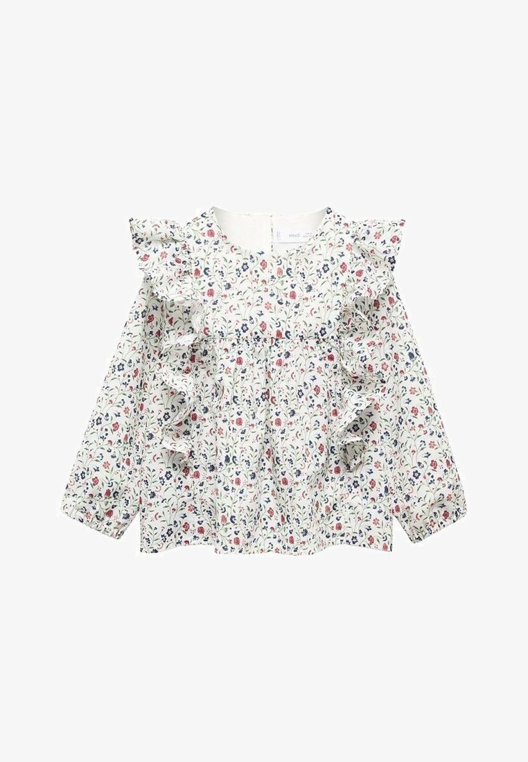 Blouse blanche à manches longues avec imprimé floral rouge et bleu de petites fleurs, présentant des volants sur le devant et les épaules.