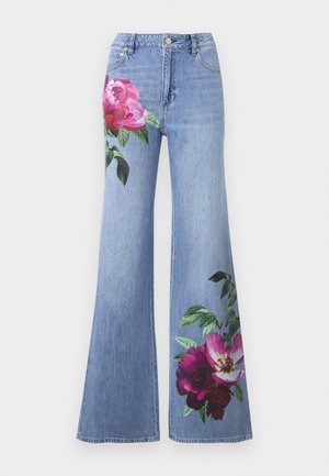 Light blue wide-leg denim jeans with pink and red floral prints on upper left thigh and lower right leg.