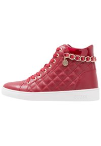 Red faux leather high-top sneaker with quilted pattern, gold chain accent around ankle, white rubber sole, and round toe.