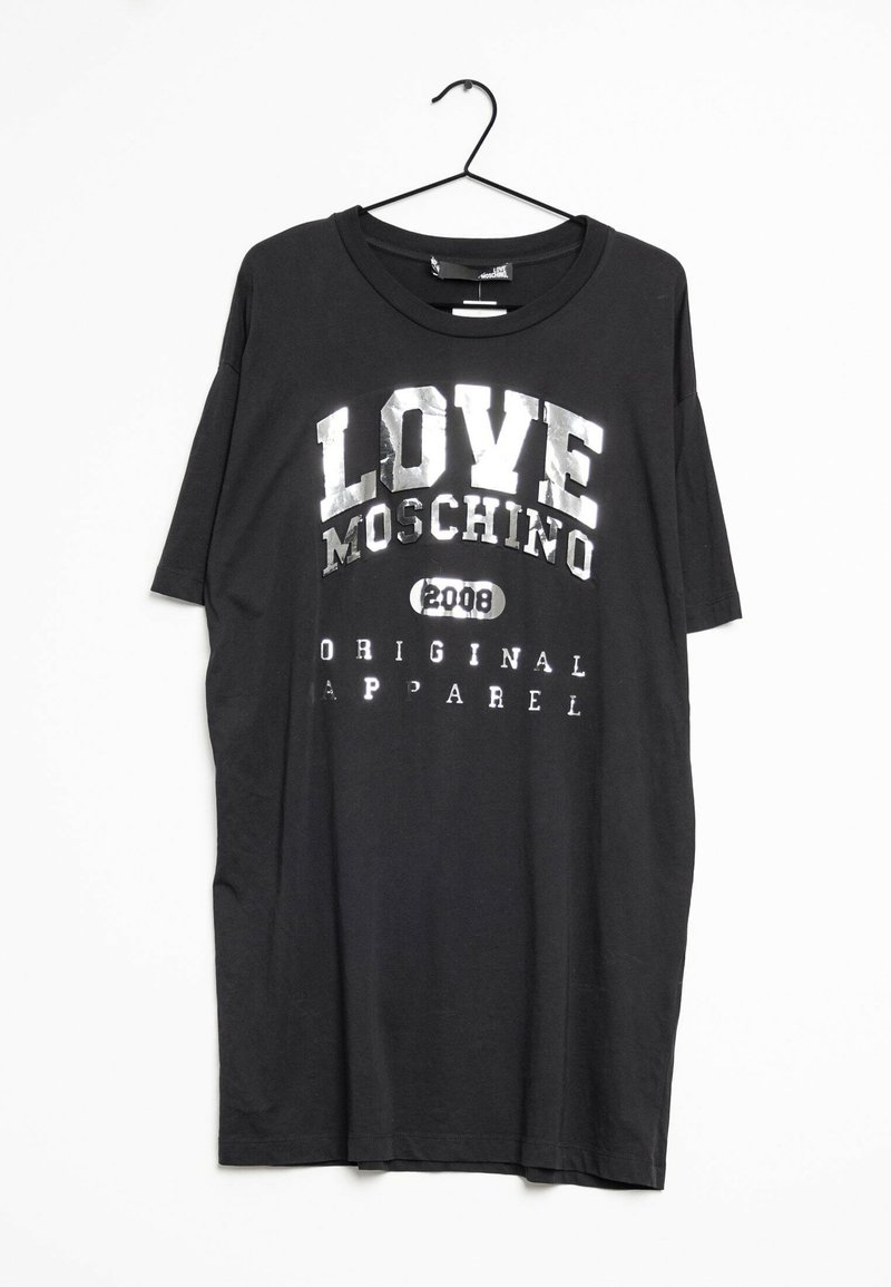 T-shirt noir avec un col rond, des manches courtes, et un imprimé graphique avec "LOVE MOSCHINO" en argent métallique, étiqueté "ORIGINAL APPAREL."
