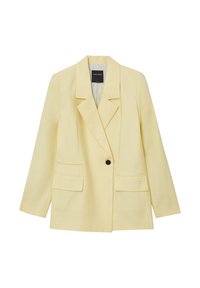 Blazer giallo, oversized, realizzato in tessuto liscio. Presenta un colletto a punta, chiusura con un singolo bottone e due tasche frontali. Fodera interna a righe.
