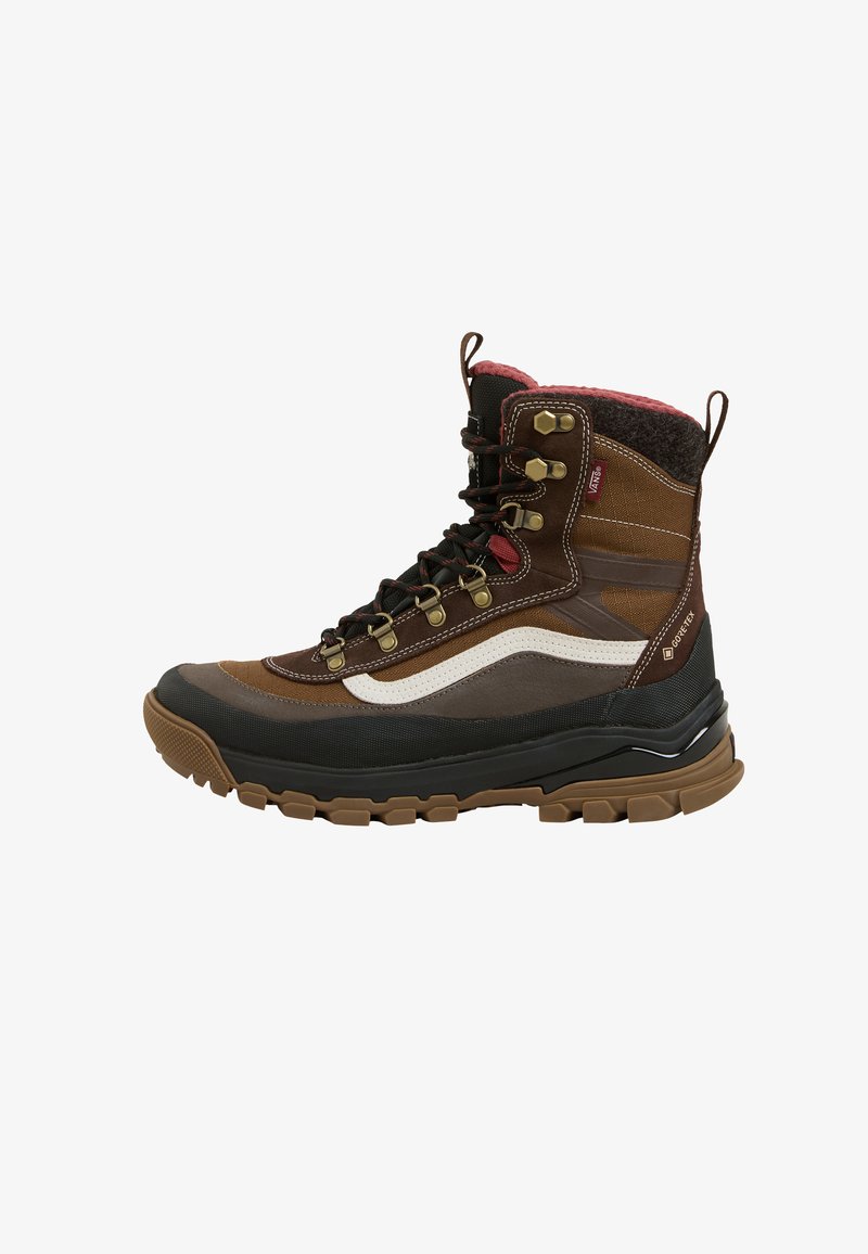Brown and black hiking boot with rubber sole, metal eyelets, white side stripe, red interior lining, and Gore-Tex fabric tag.