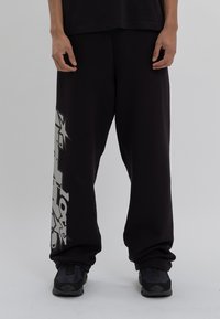 LOW LIGHTS STUDIOS® - LUCKY 7 PANTS - Tracksuit bottoms - black Thumbnail Image 1