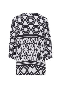 Blouse à motifs noir et blanc présentant des hexagones géométriques et des designs abstraits, avec des manches trois-quarts et une coupe décontractée.