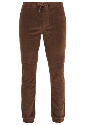 Brahne kordurojske hlače z elastičnim pasom in vrvico. Zasnova je ozka, z elastičnimi manšeti in navpičnimi šivi za teksturiran videz.