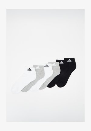 Three pairs of sports socks arranged in a row: white, gray, and black, featuring a ribbed design and Adidas logo. Soft cotton blend material.
