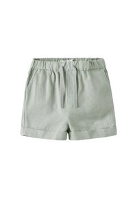 Ljusgröna linne shorts med resårmidja, snörning i midjan och uppvikta fållar. Har sidofickor för funktionalitet.