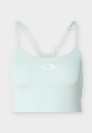 Lys blå sports-BH med justerbare stropper og The North Face-logo plassert midt på fronten.