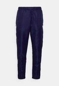 Mørkeblå joggebukser laget av glatt stoff, med elastisk midje, sidelommer med glidelås og mansjetter.