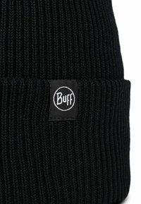 Black knitted beanie with ribbed texture. Features a folded cuff and a black tag with white "Buff" logo. Durable, stretchy material.