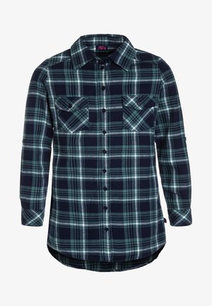 Chemise à manches longues à boutons en carreaux bleu marine, vert et blanc, avec deux poches poitrine à boutons à l'avant et un ourlet arrondi.