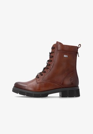 Brauner Leder-Knöchelstiefel mit schwarzer Gummisohle, schwarzen Schnürsenkeln, seitlichem Reißverschluss und metallischem Markenlogo an der Seite.