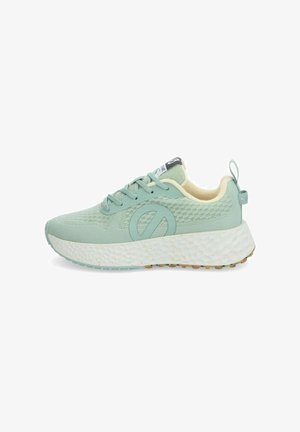 Light green athletic shoe with textured upper, round laces, and a prominent logo on the side. Thick white sole with multicolored speckles.