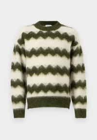 Søt grønn og hvit zigzag-mønstret genser laget av mykt, fluffy materiale med rund hals og ribbestrikkede mansjetter.