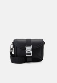 PEBBLED - Mala a tiracolo - black