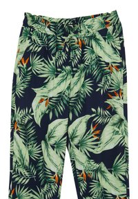 Pantalons à imprimé tropical en tissu léger, avec un fond marine orné de feuilles vertes et d'accents orange, taille élastique et cordon de serrage.