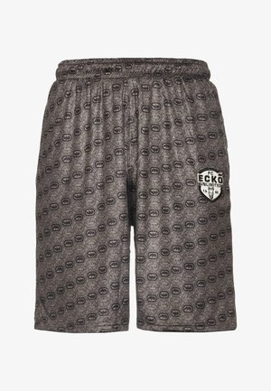 Grau Shorts aus weichem Stoff, mit einem durchgehenden Muster von Kreisen und einem schwarzen Logopatch auf dem linken Oberschenkel. Elastischer Bund sichtbar.