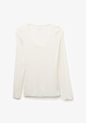 Långärmad topp med v-ringning i off-white, tillverkad av ett mjukt, lätt tyg med en slät struktur och enkel design, utan utsmyckningar.