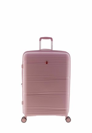 Hard-shell pink suitcase with ribbed texture, aluminum telescopic handle, and four black wheels for mobility. Features a small logo detail.