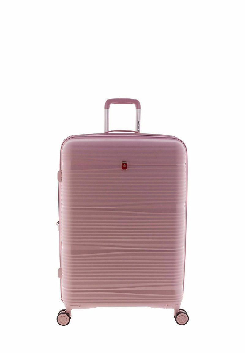 Hard-shell pink suitcase with ribbed texture, aluminum telescopic handle, and four black wheels for mobility. Features a small logo detail.