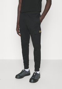 EA7 Emporio Armani - TROUSER - Tracksuit bottoms - black Thumbnail Image 1