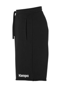 Shorts noirs en tissu doux, dotés d'une taille élastique avec cordon de serrage, de poches latérales et d'un logo "Kempa" blanc en bas.