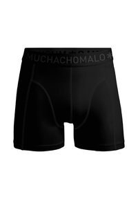 Fekete boxer alsónadrág sima anyagból, fekete derékpánttal, amelyen "MUCHACHOMALO" feliratozás található. Tartalmaz varrott varratokat és strukturált kontúrt.