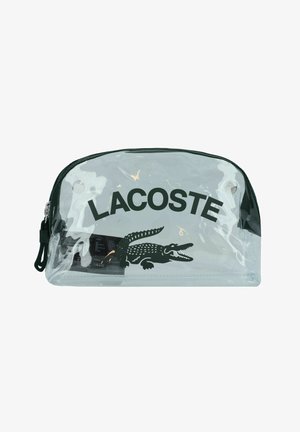 Transparante PVC-cosmetica tas met een zwarte ritssluiting, met in het vetgedrukt de tekst "LACOSTE" en een groen krokodillenlogo aan de voorkant. Soepele textuur.