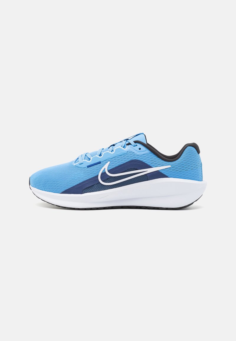 Blue mesh running shoe with navy accents, white swoosh logo, and cushioned white midsole. Features a textured surface and reinforced heel.