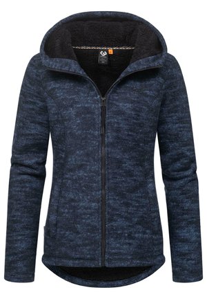 Veste en polaire bleu foncé avec un intérieur doux, fermeture éclair à l'avant et capuche. Présente une texture légèrement chinée et un ourlet arrondi.