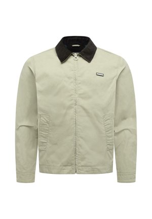 Beige Reißverschlussjacke mit schwarzem Kragen, zwei Vorder taschen und einem kleinen rechteckigen Markenschild auf der linken Brust.