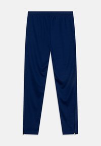 Pantalons de sport navy en tissu lisse, dotés d'une taille élastique et de chevilles zippées pour un ajustement personnalisable.