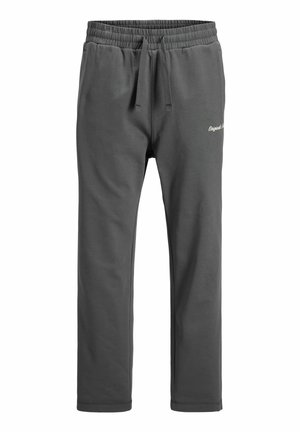 Pantalon de survêtement gris foncé avec taille élastique, cordon de serrage et petit logo en script blanc sur la partie supérieure de la cuisse gauche.