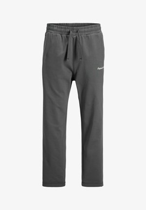 Pantalon de survêtement gris foncé avec taille élastique, cordon de serrage et petit logo en script blanc sur la partie supérieure de la cuisse gauche.