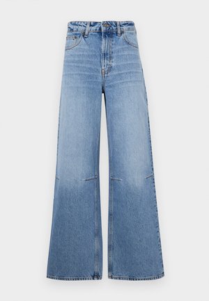 Light blue wide-leg denim jeans with a high waist, featuring front pockets and seam detailing running vertically down the legs.