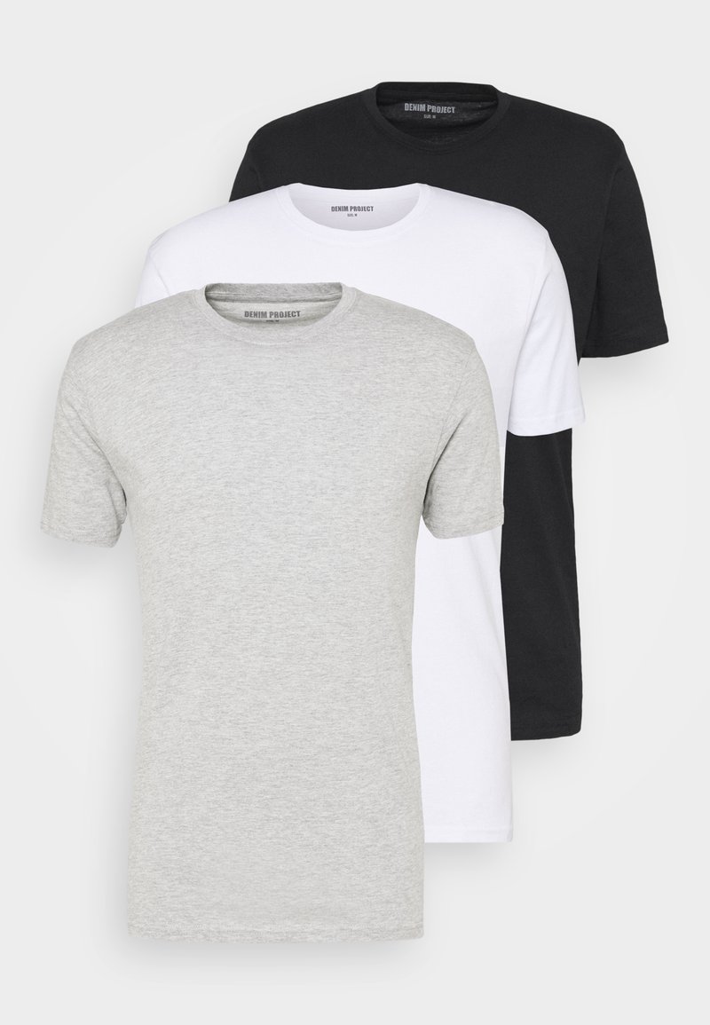 Tres camisetas de manga corta en negro, blanco y gris. Cuellos redondos, tejido de algodón suave. Diseño simple sin patrones ni acentos.